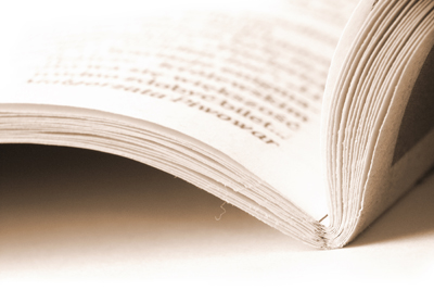 A picture of the seams and binding of a book.