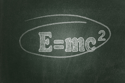 A picture of the following quotation written on a chalkboard: e=mc2.